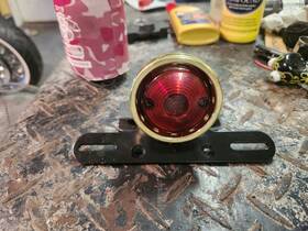 Pc 728044674628 Tail Light Drilled Anodized Brass Std Bulb - Harley Triumph Xs650 Bobber Chopper