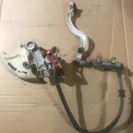 Used 2005 Honda CRF450R Rear Brake Assembly - Master Cylinder Caliper Line Pads. Fixed Price $49.00.